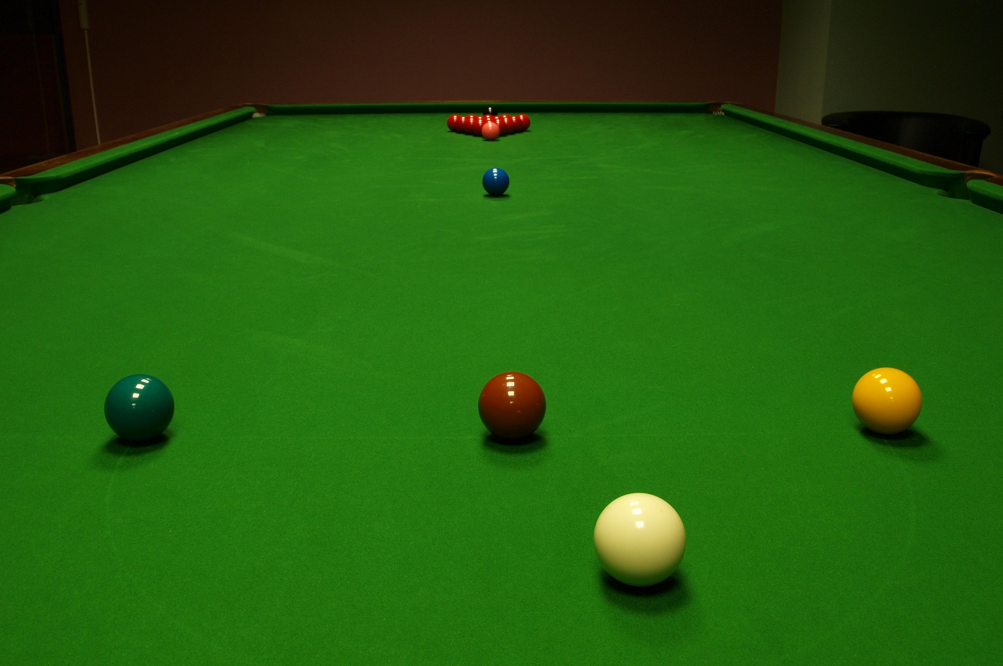 What is snooker and how does it differ from billiards?